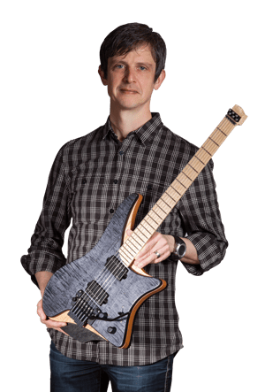 Ola Strandberg holding Headless guitar