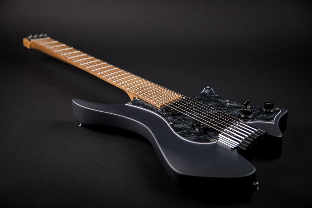 Headless Boden Graphite Classic 7 featuring a black pearloid pickguard and roasted maple fretboard.