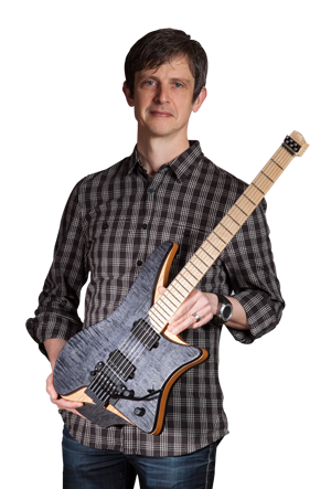 Ola Strandberg holding Headless guitar