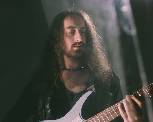 Jack gardiner playing his Classic 6 string malta blue headless guitar